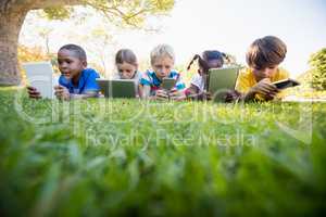 Kids using technology during a sunny day