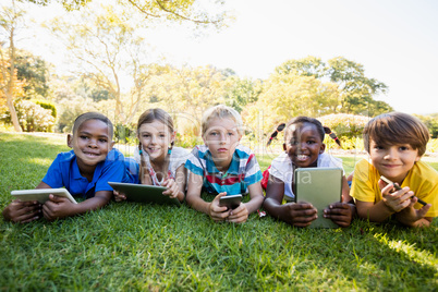 Kids using technology during a sunny day