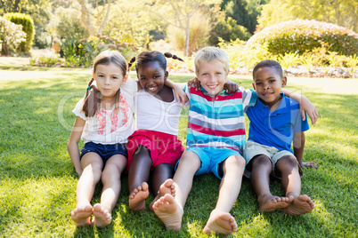 Kids posing together during a sunny day at camera