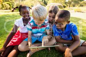 Kids using technology during a sunny day