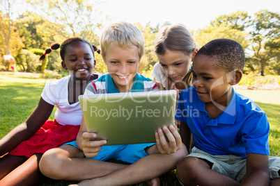 Kids using technology during a sunny day