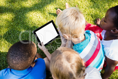 Kids using technology during a sunny day