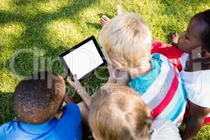 Kids using technology during a sunny day