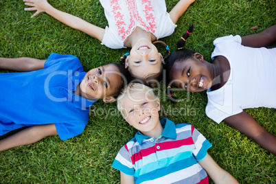 Kids posing together during a sunny day at camera