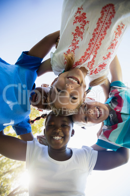 Kids posing together during a sunny day at camera