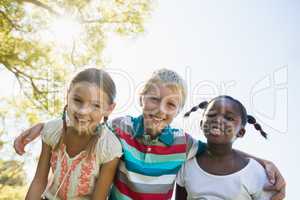 Kids posing together during a sunny day at camera