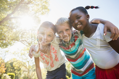 Kids posing together during a sunny day at camera