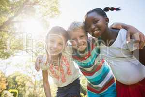 Kids posing together during a sunny day at camera