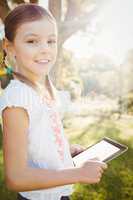 Kid using technology during a sunny day