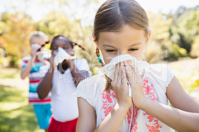 Kids are blowing during a sunny day