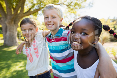 Kids posing together during a sunny day at camera