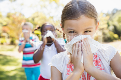 Kids are blowing during a sunny day