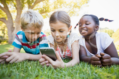 Kids using technology during a sunny day