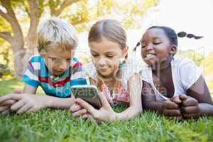 Kids using technology during a sunny day