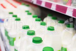 Milk bottles tidied in shelf