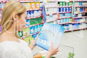 Over shoulder view of woman looking product