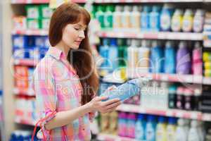 Profile view of woman choosing detergent