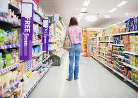 Rear view of woman standing in aisle