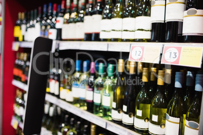 Focus on wine bottle shelf