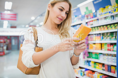 Serious woman buying a product