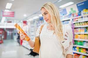 Profile view of woman holding a shampoo