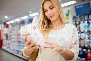 Smiling woman choosing product