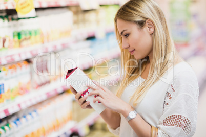 Customer looking at a bottle of fruit juice