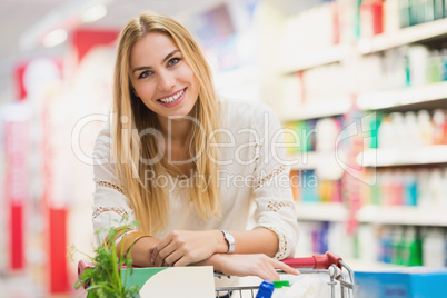 Smiling woman at the supermarket