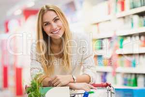 Smiling woman at the supermarket