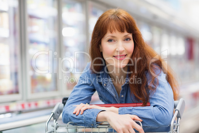 Smiling customer crossing the frozen aisle