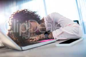 Businesswoman sleeping on her desk