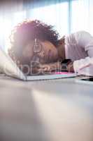 Businesswoman sleeping on her desk