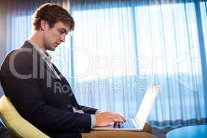 Young businessman working on his computer