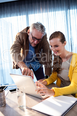 Two businessmen working on a computer