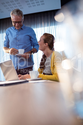 Two workmates having a break at work