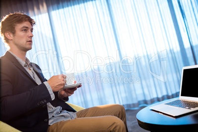 Young businessman drinking a coffee