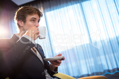 Young businessman drinking a coffee