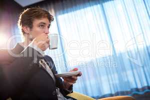 Young businessman drinking a coffee