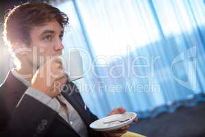 Young businessman drinking a coffee