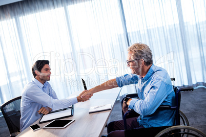 Two businessmen giving a handshake