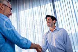 Two businessmen giving a handshake