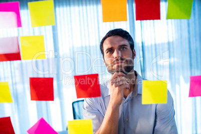 Businessman reading post it