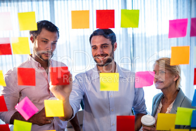 Businessmen reading post it