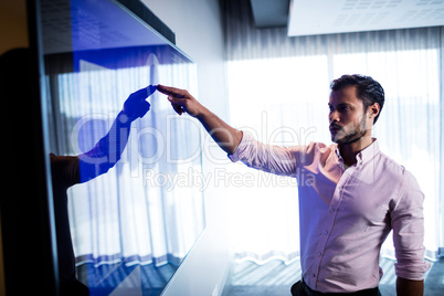 Businessman using touch screen