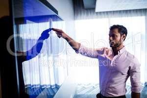 Businessman using touch screen