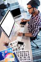 Photographer working at computer desk