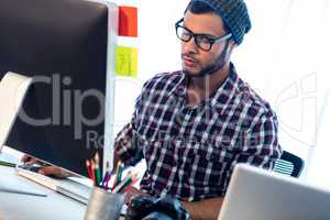 Photographer working at computer desk