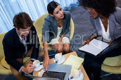 Business people meeting around a table