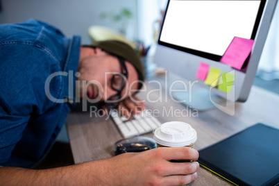 Hipster businessman sleeping at his desk