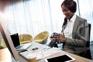 Businesswoman using a camera